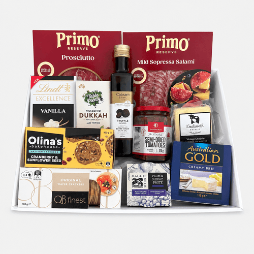 Gourmet Entertainer’s Antipasto Gift Tray with Primo Prosciutto, mild salami, cheddar and brie cheeses, semi-dried tomatoes, truffle olive oil, crackers, dukkah mix, plum & Shiraz paste, and Lindt chocolate