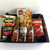Ultimate Beer & Nibbles Hamper with 3 bottles of Corona, Bhuja mix, pork crackles, and Nobby’s Salted Beer Nuts, wrapped in cellophane with ribbons