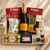 Veuve Champagne gift tray with assorted cheeses, charcuterie, crackers, olives, chocolate, and plum & Shiraz paste