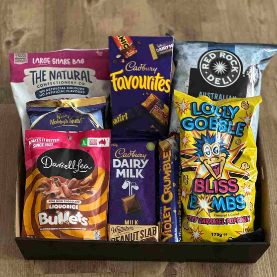 Gift tray with Chips chocolate lollies caramel popcorn bullets, nuts, chocolate and peanut slab and crumble.
