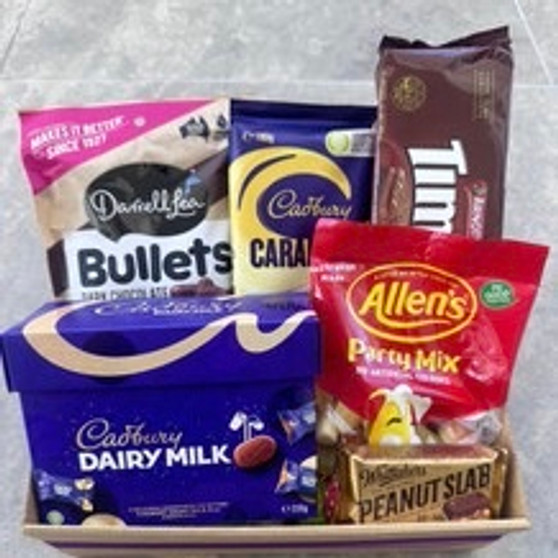 GIFT HAMPER WITH TIM TAMS CHOCOLATES, BULLETS, DAIRY MILK CHOCOLATES AND BAG OF SOFT LOLLIES AND PEANUT SLAD.