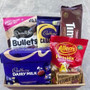 GIFT HAMPER WITH TIM TAMS CHOCOLATES, BULLETS, DAIRY MILK CHOCOLATES AND BAG OF SOFT LOLLIES AND PEANUT SLAD.