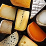 different varities of cheese cut into different shapes.