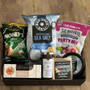 Gift ray with a mix of savoury and sweet items. Chips, lollies, mixed nuts, crackers, chutney, dip and cheese.