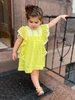 Toddler girl wearing lemon yellow angel-sleeve dress with white crochet lace trim - Sophie Catalou Kate Dress