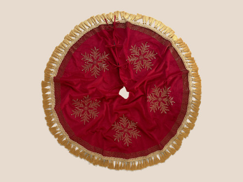 Luxury red velvet Christmas tree skirt by SADE New York, featuring five gold-beaded snowflakes, sparkling crystal accents and elegant gold tassel fringe.