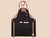 Personalized work apron with leather cross-back straps, front pockets, and durable canvas body