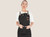 Female model wearing a black personalized canvas apron with leather straps by Sade New York
