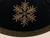 Close-up of black cotton velvet Christmas tree skirt showing intricate gold rhinestone snowflakes and sparkling stud crystal detailing.