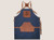 Navy cotton canvas apron with leather pockets and comfortable adjustable straps