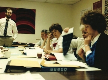 Photo of Stan Gray in a sales meeting 