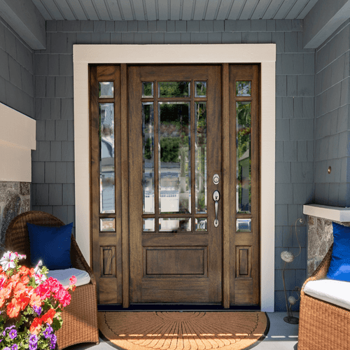 Prairie style mahogany 9 Lite front entry door with matching sidelights featuring clear bevel glass for timeless elegance and natural light. Available at GrandEntryDoors.com.