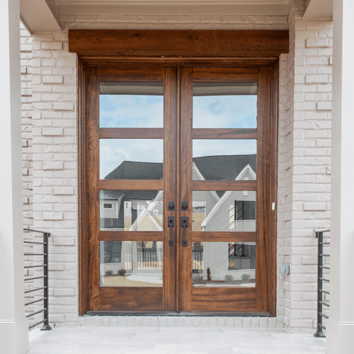 Modern mahogany 4 Lite double entry door with clear Low E glass and clean contemporary lines, available at Grandentrydoors.com.