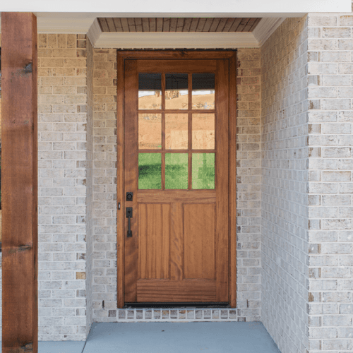 Oversized 42 x 96 mahogany 9 Lite half lite single front door with clear Low-E glass, highlighting elegant design and rich wood grain. Available at Grandentrydoors.com.