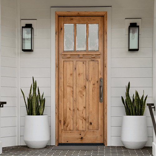Knotty alder Craftsman single front door with three lite clear glass, vertical plank panels, and natural wood grain for a warm, inviting entry.