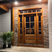 Knotty alder 6 Lite front entry door with matching sidelights and transom featuring clear bevel glass for rustic charm and natural light. Available at GrandEntryDoors.com.