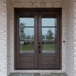 Beautiful mahogany 3 lite double entry door with clear bevel glass for classic curb appeal. Available at GrandEntryDoors.com.