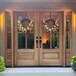 Beautiful mahogany wood 4 Lite double entry doors with sidelights that add light, style, and warmth to any home exterior. Available at GrandEntryDoors.com.
