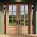 Mahogany 6 Lite double entry door with matching sidelights featuring clear bevel glass for a bright, elegant entrance. Available at GrandEntryDoors.com.