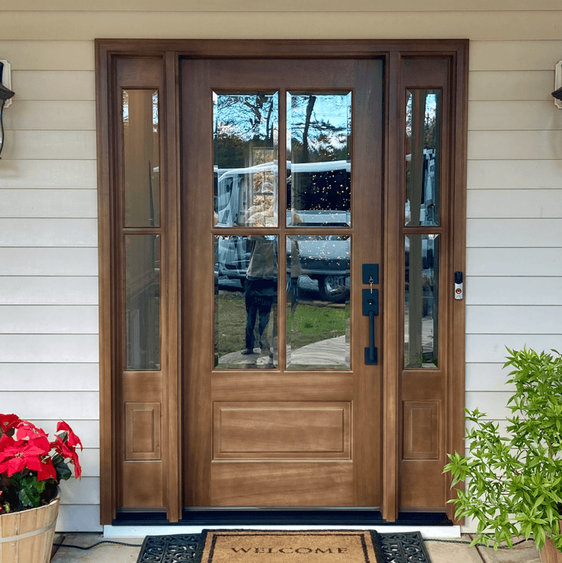 Stylish 4 Lite mahogany entry door with clear glass and elegant sidelights. Available at Grandentrydoors.com.