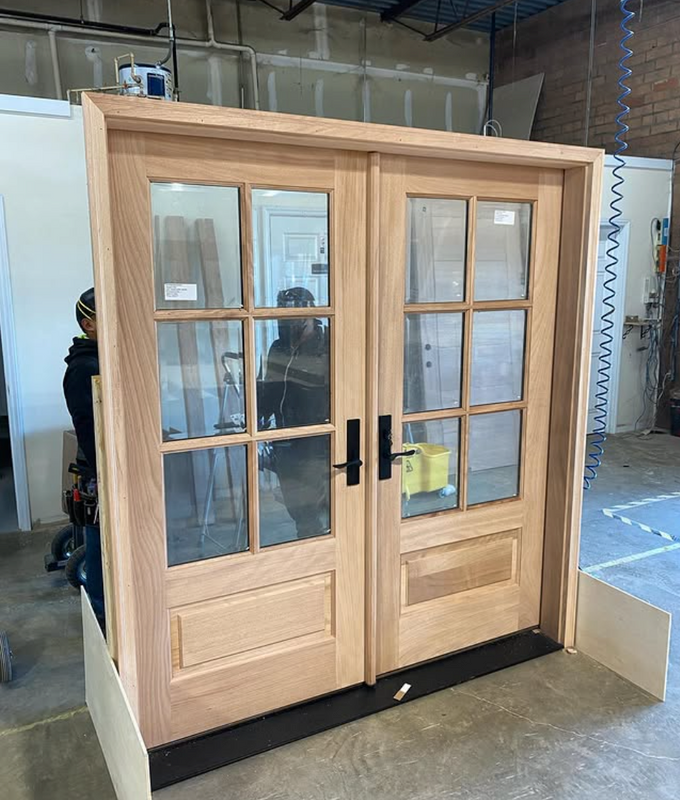 Unfinished pre-hung 6 Lite mahogany double entry door being factory inspected prior to shipping. Available at GrandEntryDoors.com.Photo Credit @onbroadwayhome (instagram) Unfinished pre-hung 6 Lite mahogany double entry door being factory inspected prior to shipping. Available at GrandEntryDoors.com.Photo Credit @onbroadwayhome (instagram)