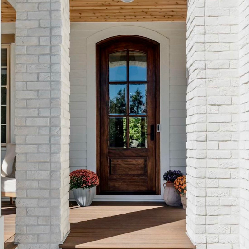 Elegant mahogany 6 Lite arched single front door with clear bevel glass that enhances curb appeal and classic design. Available at GrandEntryDoors.com.