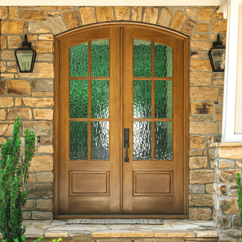 Stunning mahogany double entry door with 6 lite arch top style and Flemish glass.