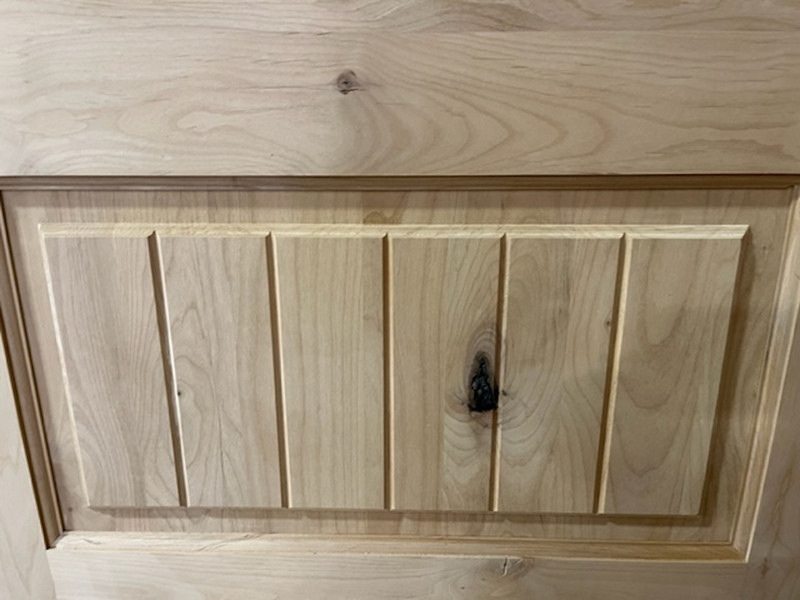 Knotty Alder wood grain and vertical v-groove lower panel as seen on the knotty alder doors from Grand Entry Doors Knotty Alder wood grain and vertical v-groove lower panel as seen on the knotty alder doors from Grand Entry Doors