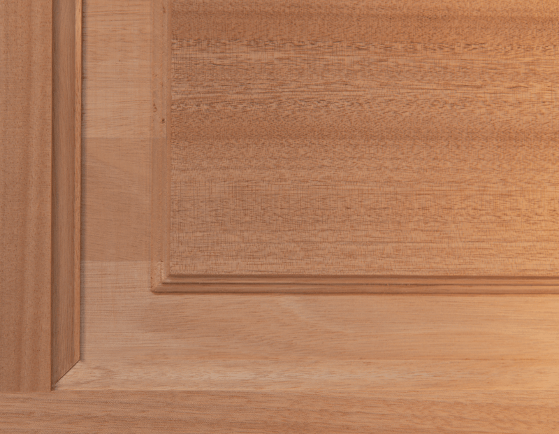 Unfinished mahogany door panel highlighting natural wood grain, smooth surface, and fine craftsmanship, ready for custom staining or finishing. Available at GrandEntryDoors.com.