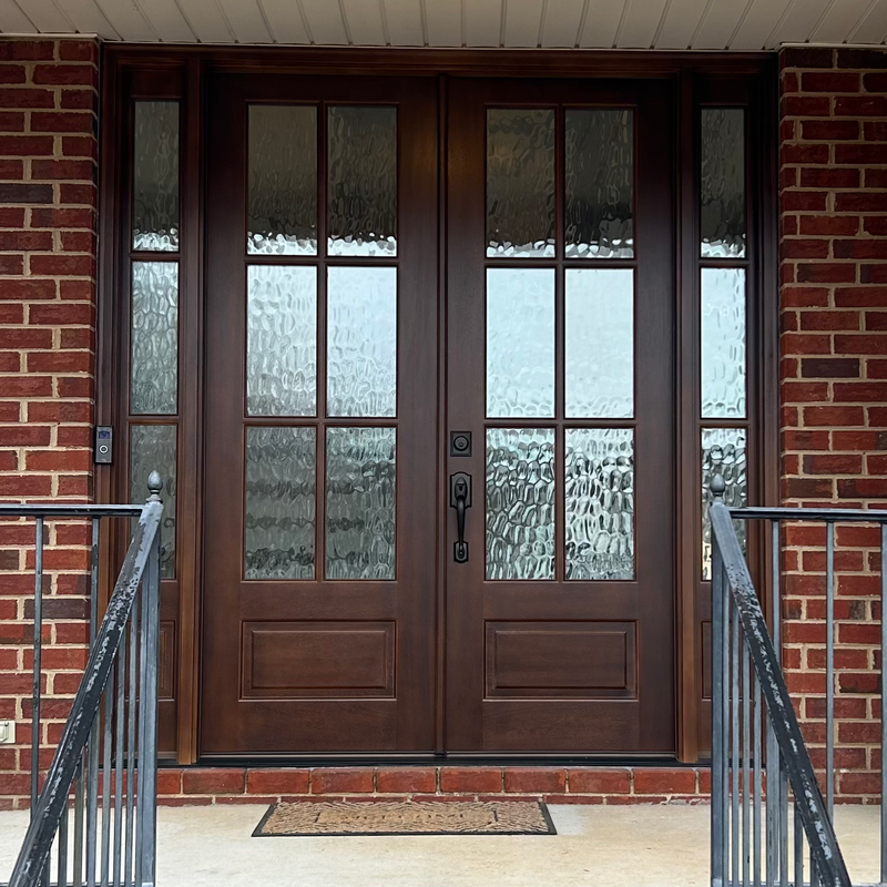 Beautiful 6 Lite mahogany double front door with sidelights and Flemish glass that adds warmth and timeless charm. Available at GrandEntryDoors.com.