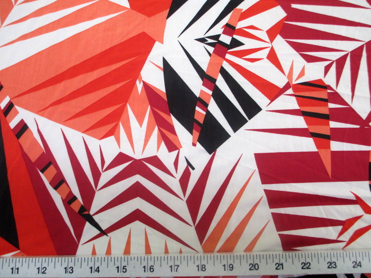 Discount Fabric Printed Lycra Spandex Stretch Orange Black Bamboo Leaves  A300