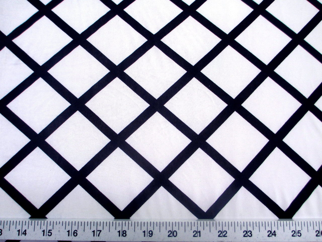 Discount Fabric Printed Jersey Knit ITY Stretch White Diamond Black Lattice C402