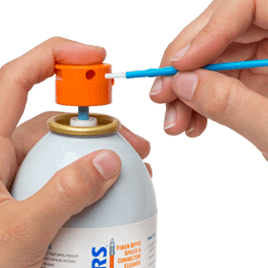 MCC-S25 - Cleaning stick for 2.5mm ferrules (SC, FC, ST, etc.), stick being inserted in cleaner spray nozzle