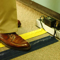 person stepping on yellow & black SAFCORD