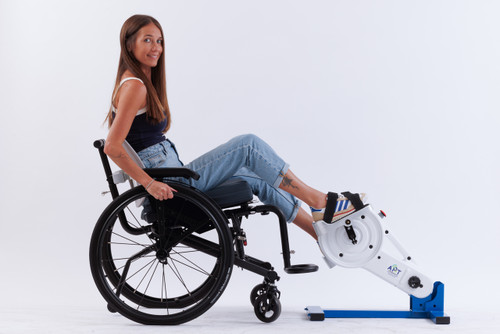 Adult using APT 5+ Active Passive Trainer at home for rehabilitation.  APT 5+ adjustable foot pedals for lower body rehabilitation