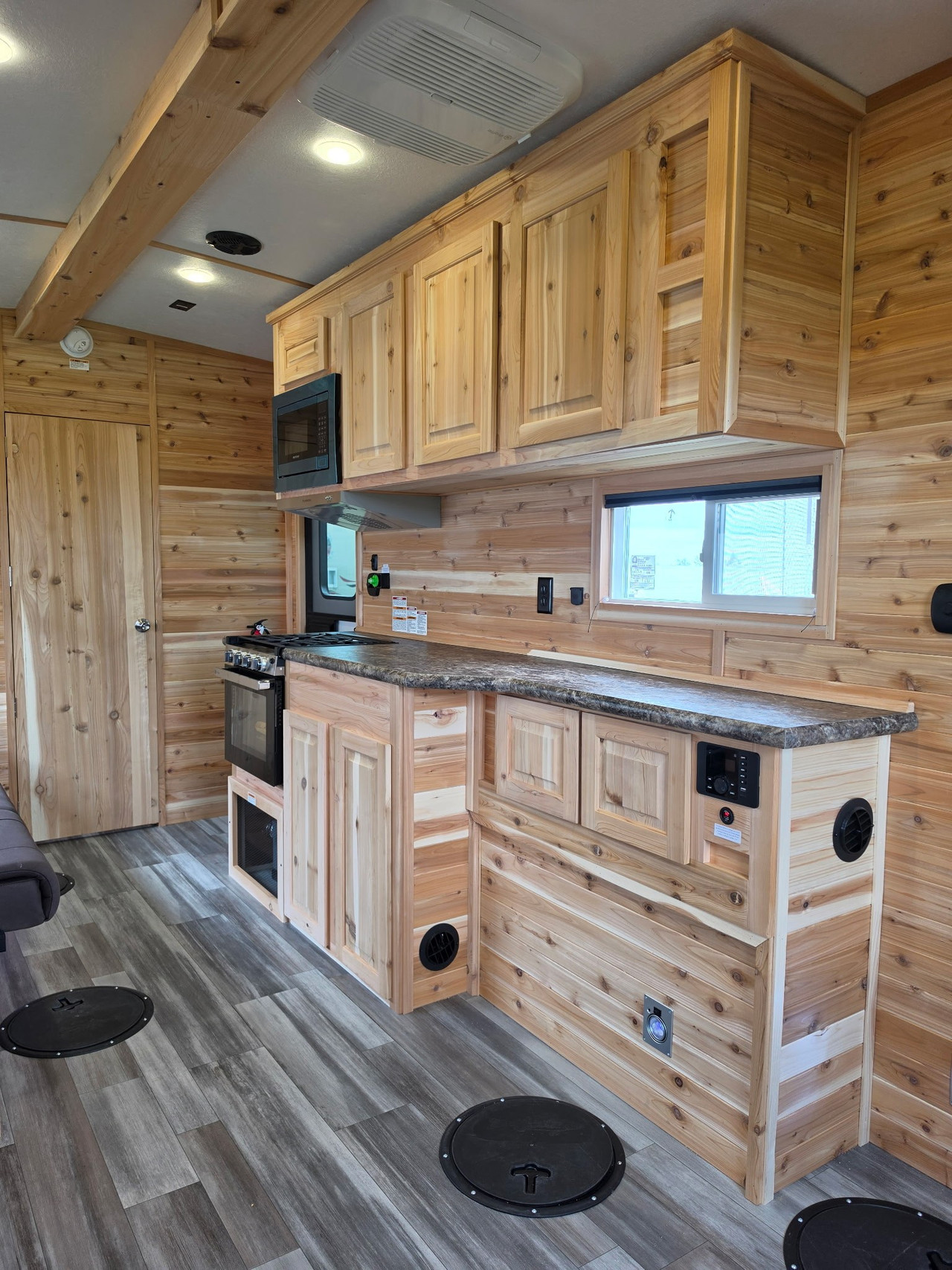 Ice Castle fish house kitchen with custom cabinets appliances and fishing holes