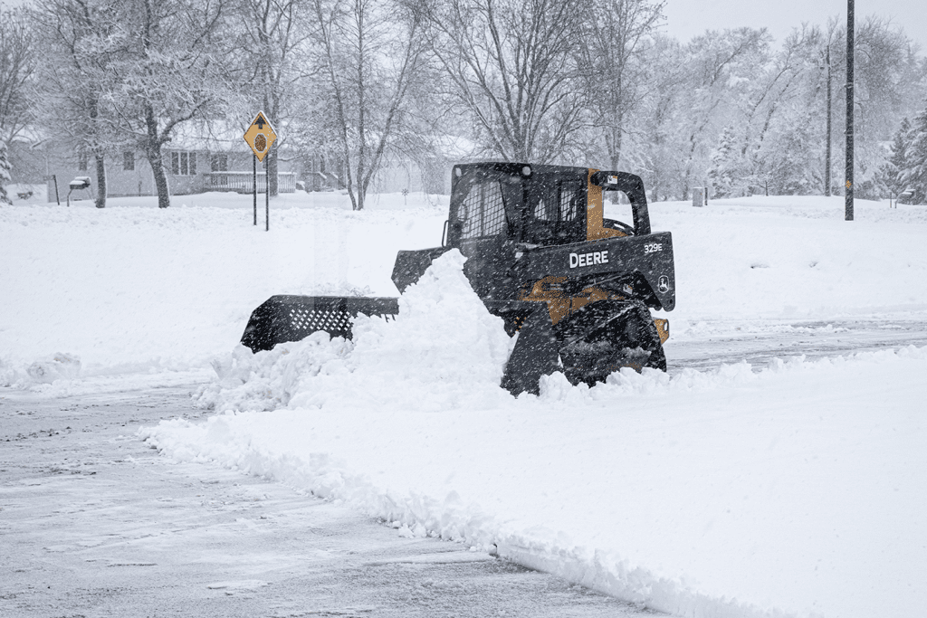 Skid steer snow removal in winter