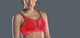 Air Control Delta Pad Sports Bra in Coral/Anthracite
