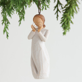 Hanging angel figurine ornament in white dress holding silver heart