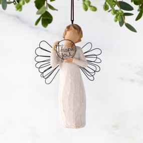 Female angel figure with wire wings holding wire circle with "thank you" written in wire inside of it, ornament loop on figure's head