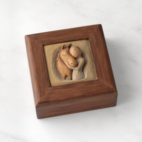 Dark brown square wood box with hinged lid, carving on lid of female in green dress, with arms embracing reddish-color horse