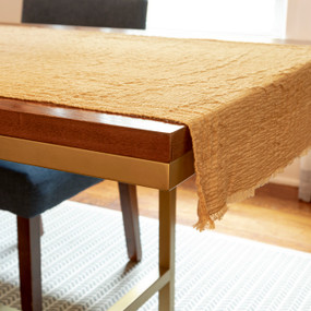 2 ft by 5 ft gauze fabric with gradation of color along length of mustard to sand to mustard, to use under Nativity