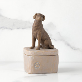 Front: gray square resin box with lid, 3-D figure of dark color dog atop lid