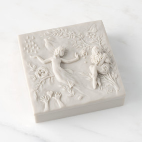 Closed white resin box; lid carved with figural and organic imagery