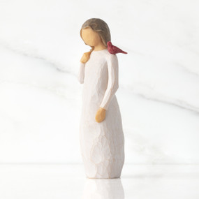 Front view of standing figure in cream dress with cardinal red bird perched on shoulder