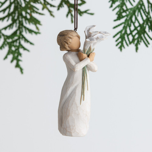 Hanging faceless girl figurine ornament wearing white dress and holding white flowers
