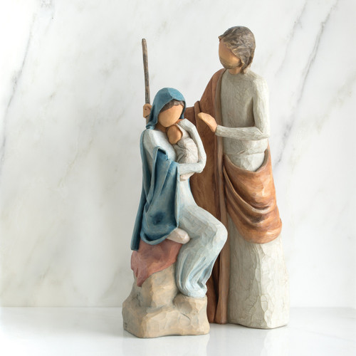 Nativity scene figurines - mother in blue holding child with father standing over them