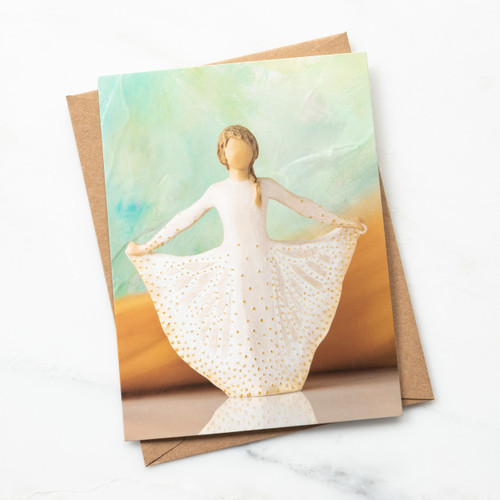 Notecard with image of figure holding gold-dotted cream skirt with both hands. Skirt is carved like Monarch. Blank inside