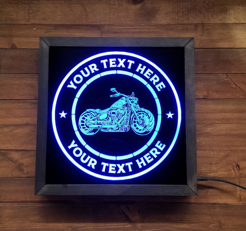 Rev up your motorcycle decor with a personalized LED sign. Customize the top and bottom lines with your own text and choose from 20 colors. Comes with a 44-key remote and power cord. Cool skeleton riding a motorcycle design in a wood frame.