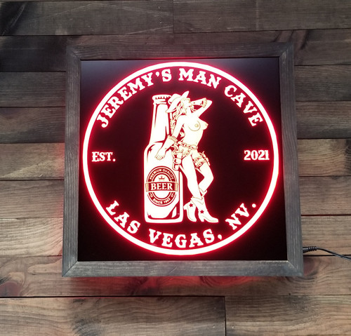 Elevate your home bar or man cave with our Personalized Beer LED Sign featuring a customizable beer bottle and cowgirl design. With an engraved black acrylic front and wood frame, this sign adds a touch of class to any space. Customize the top and bottom lines and choose from 20 color options with the included 44 key remote. Easy to set up with the included power cord. Perfect for any beer enthusiast.